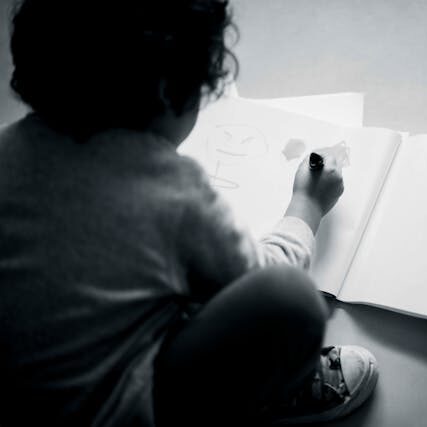 A little child draws